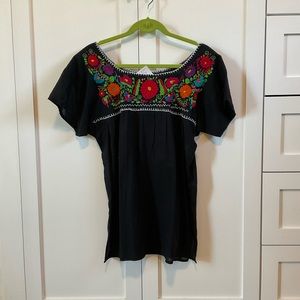 Short sleeve boho top with colorful, embroidered flowers; Made in Mexico